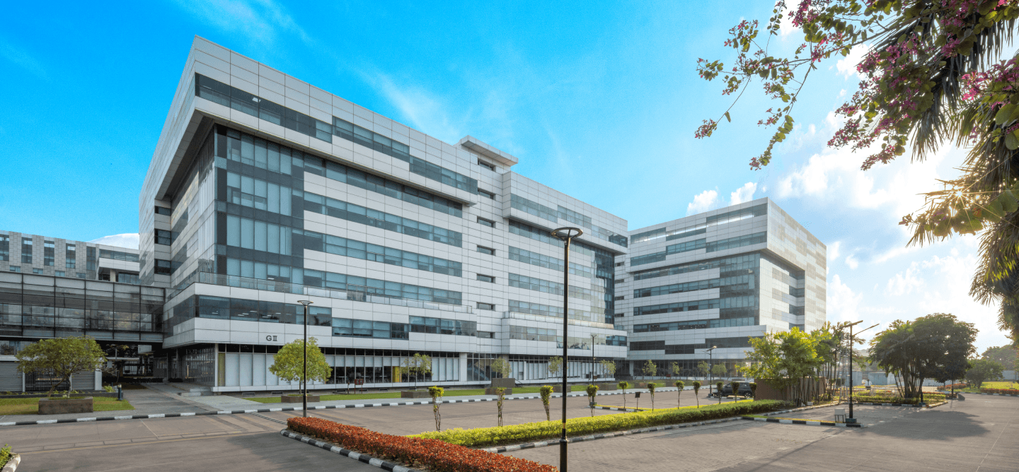 Modern office building exterior, glass and steel architecture, business district, Mumbai, India.