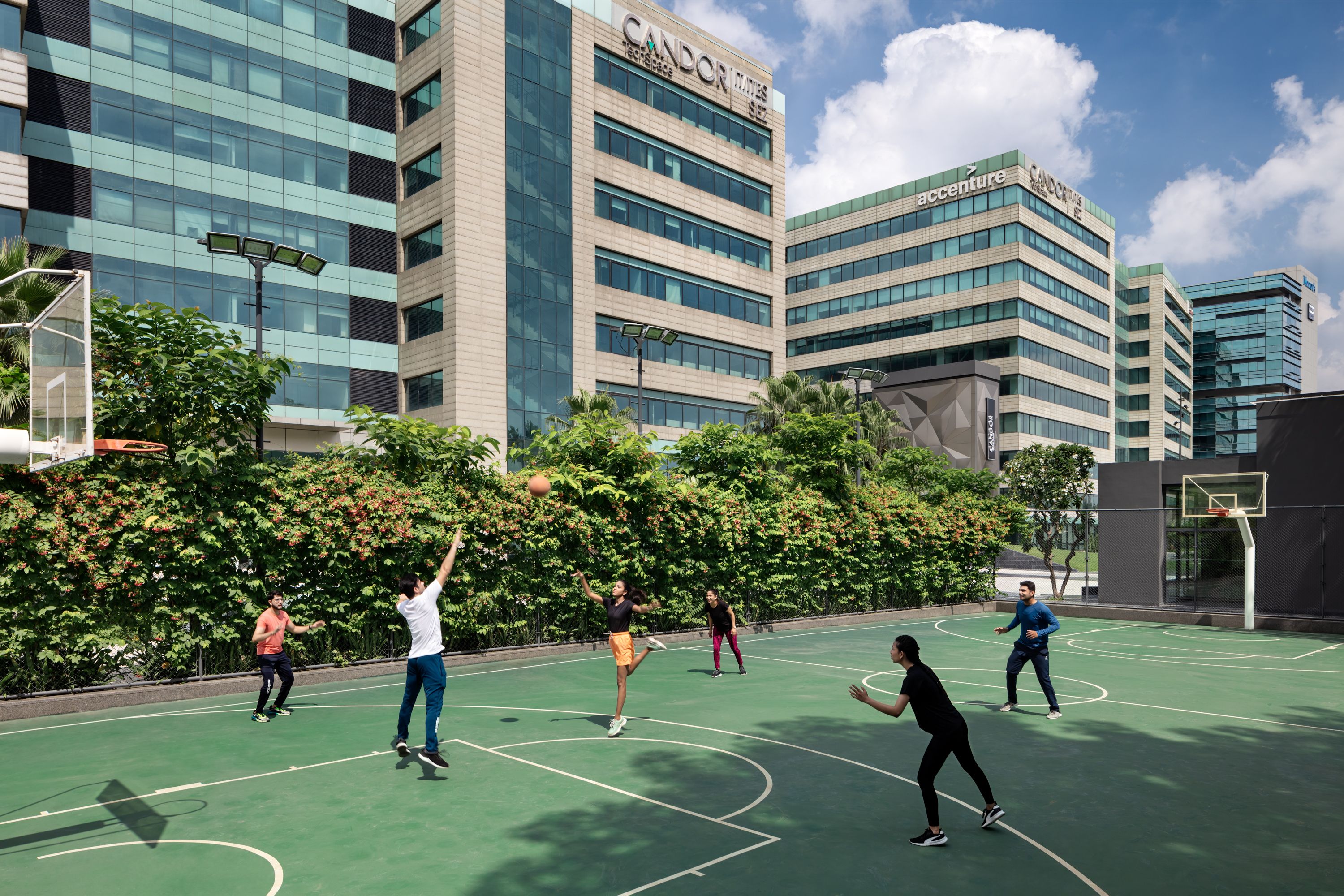 Outdoor basketball court with hoop and net, ready for play. Recreational space.