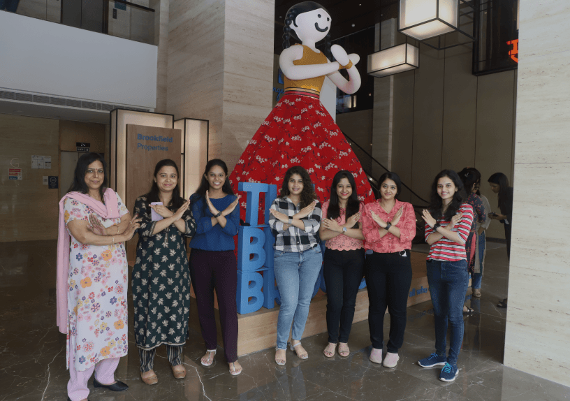International Women's Day celebration with diverse women empowering each other.