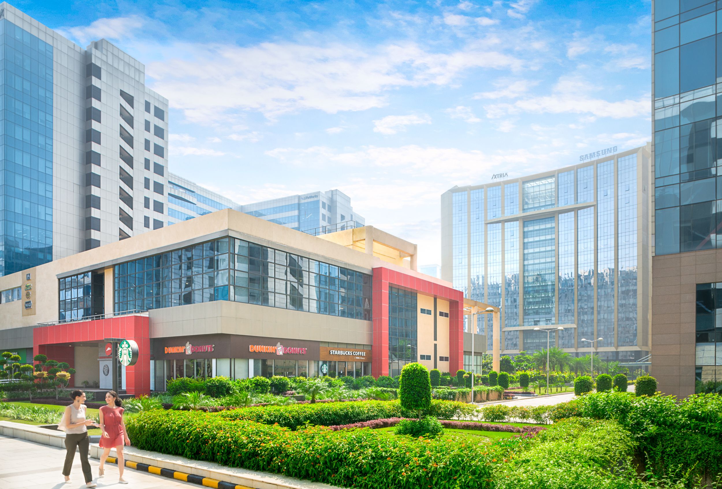 Modern residential complex amenities including pool, gym, and green spaces.