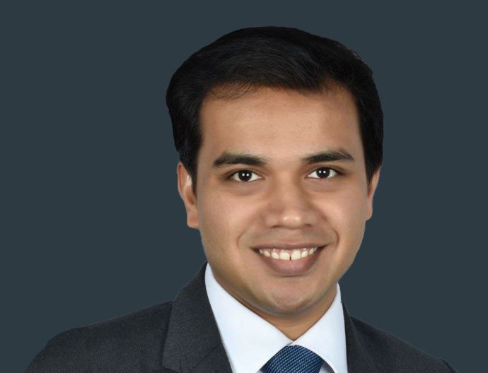 Rachit Kothari, Brookfield India REIT executive, smiling professionally in an office setting.