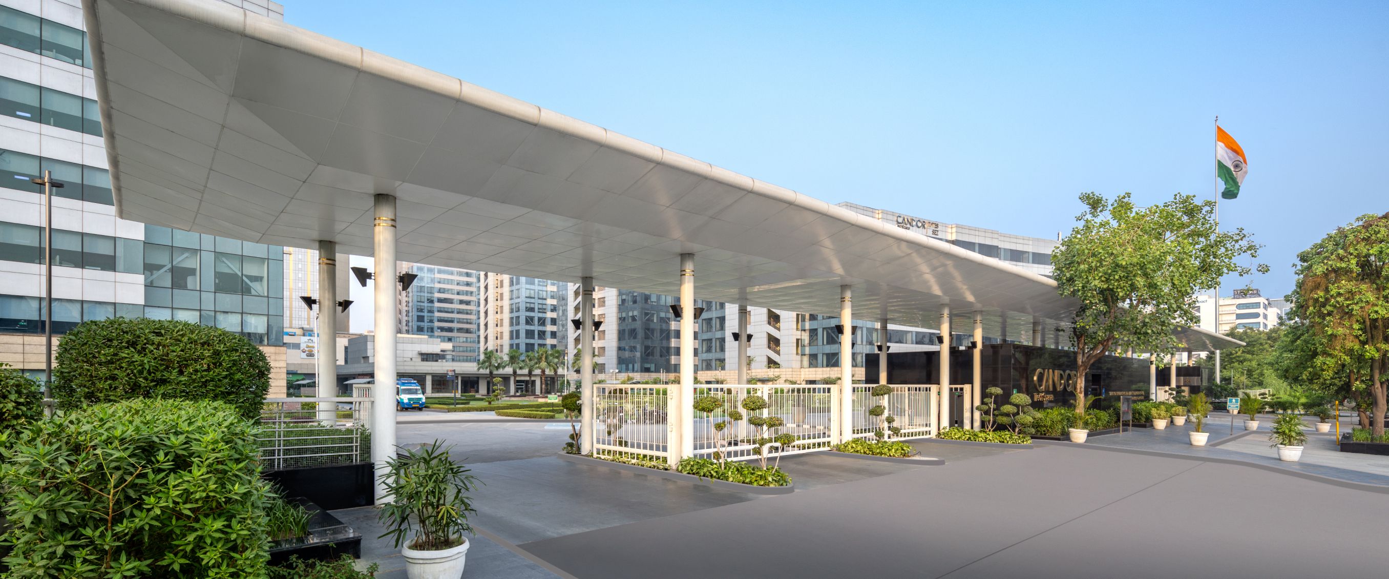 Modern office building exterior, glass and steel architecture, commercial real estate, Brookfield India REIT.