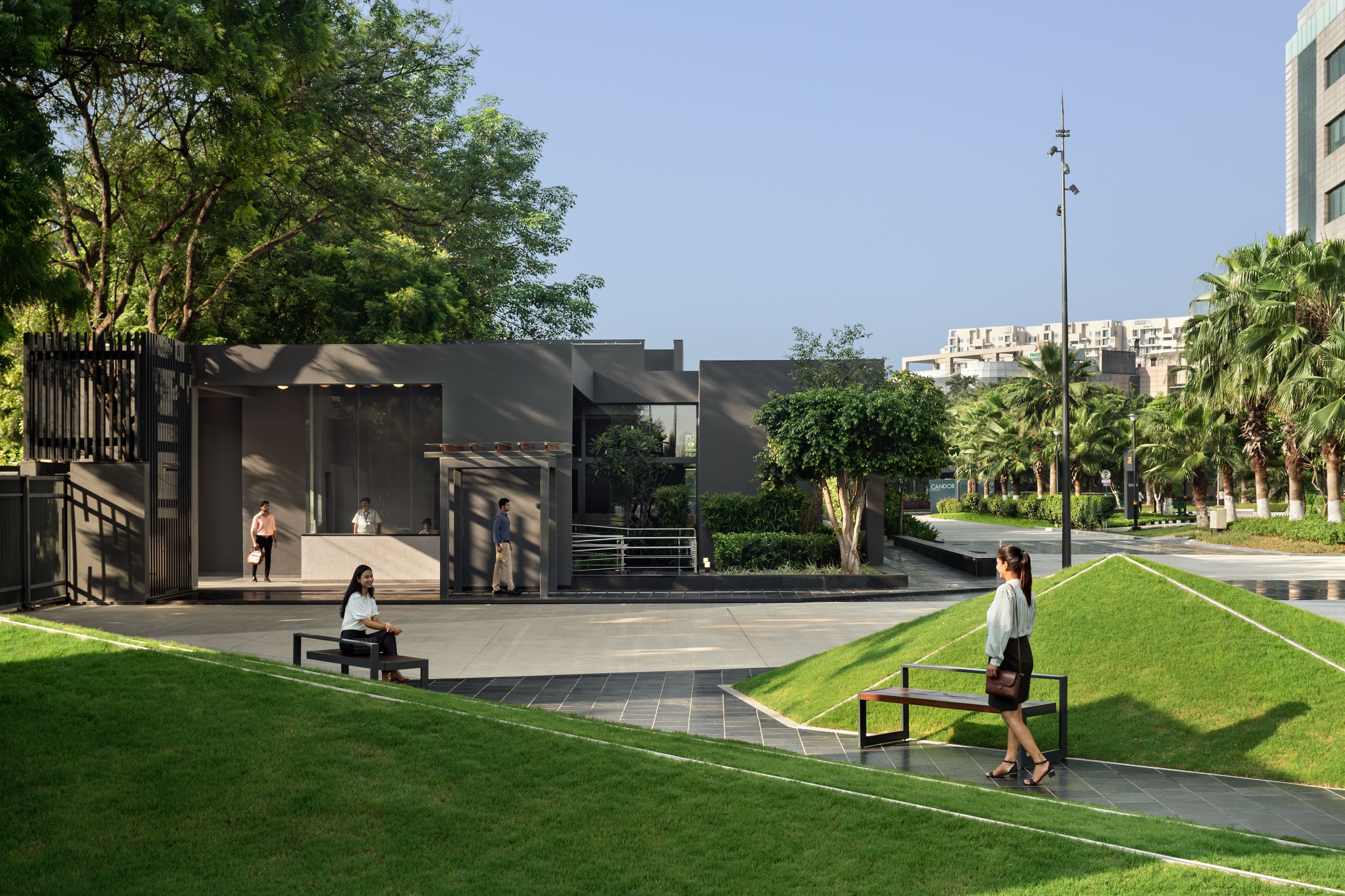 Modern Sitout area near VMS, Chennai. Outdoor seating, landscaping, and commercial property appeal.