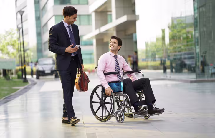 Diverse team collaborating in modern office space, promoting inclusive hiring practices.