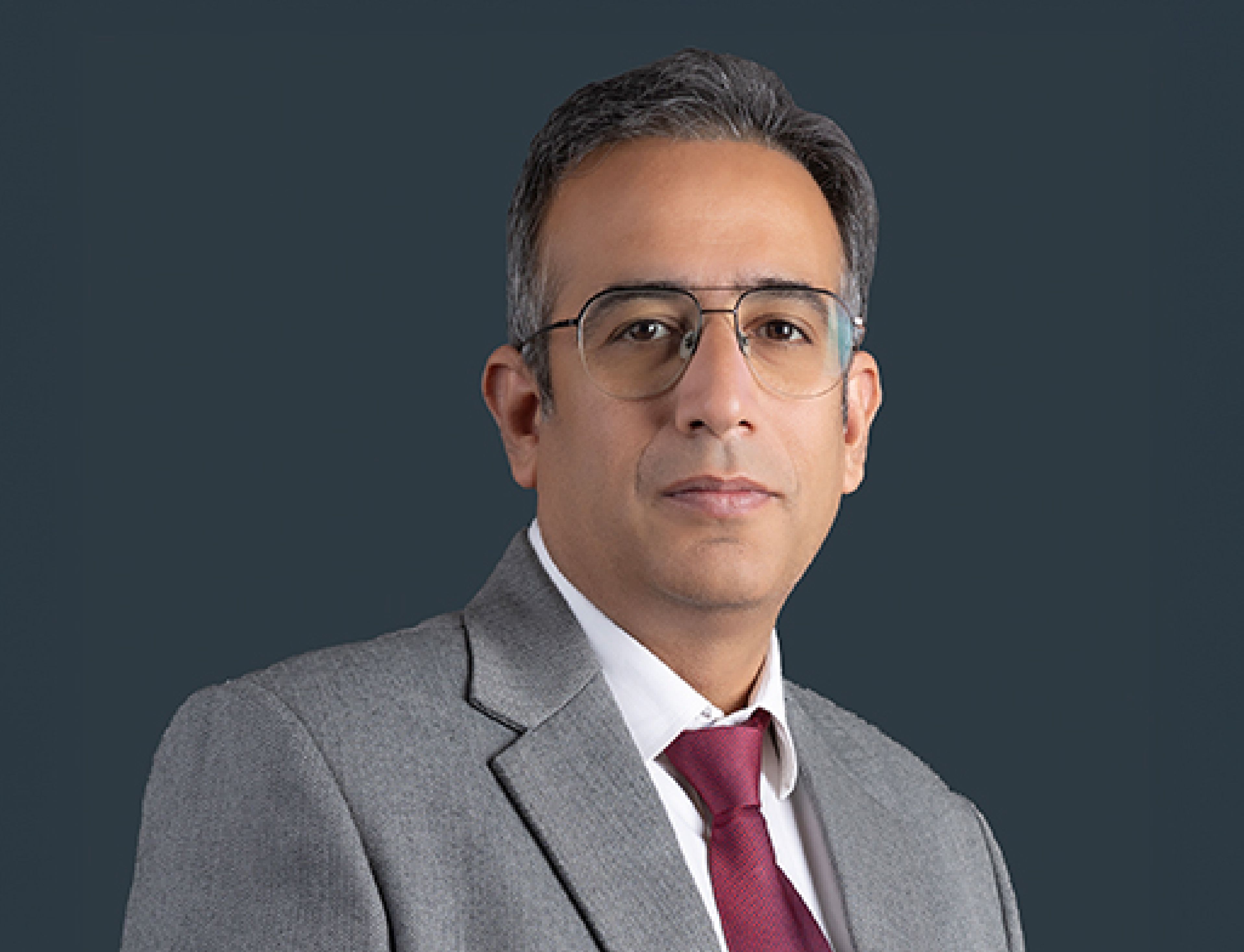 Rahul Gambhir, Brookfield India REIT executive, smiling professionally in an office setting.