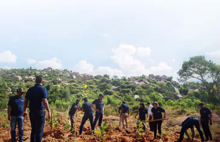 Tree planting initiative by Brookfield India REIT, promoting sustainability and environmental responsibility.